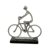 Silver Man Sculpture on Bicycle